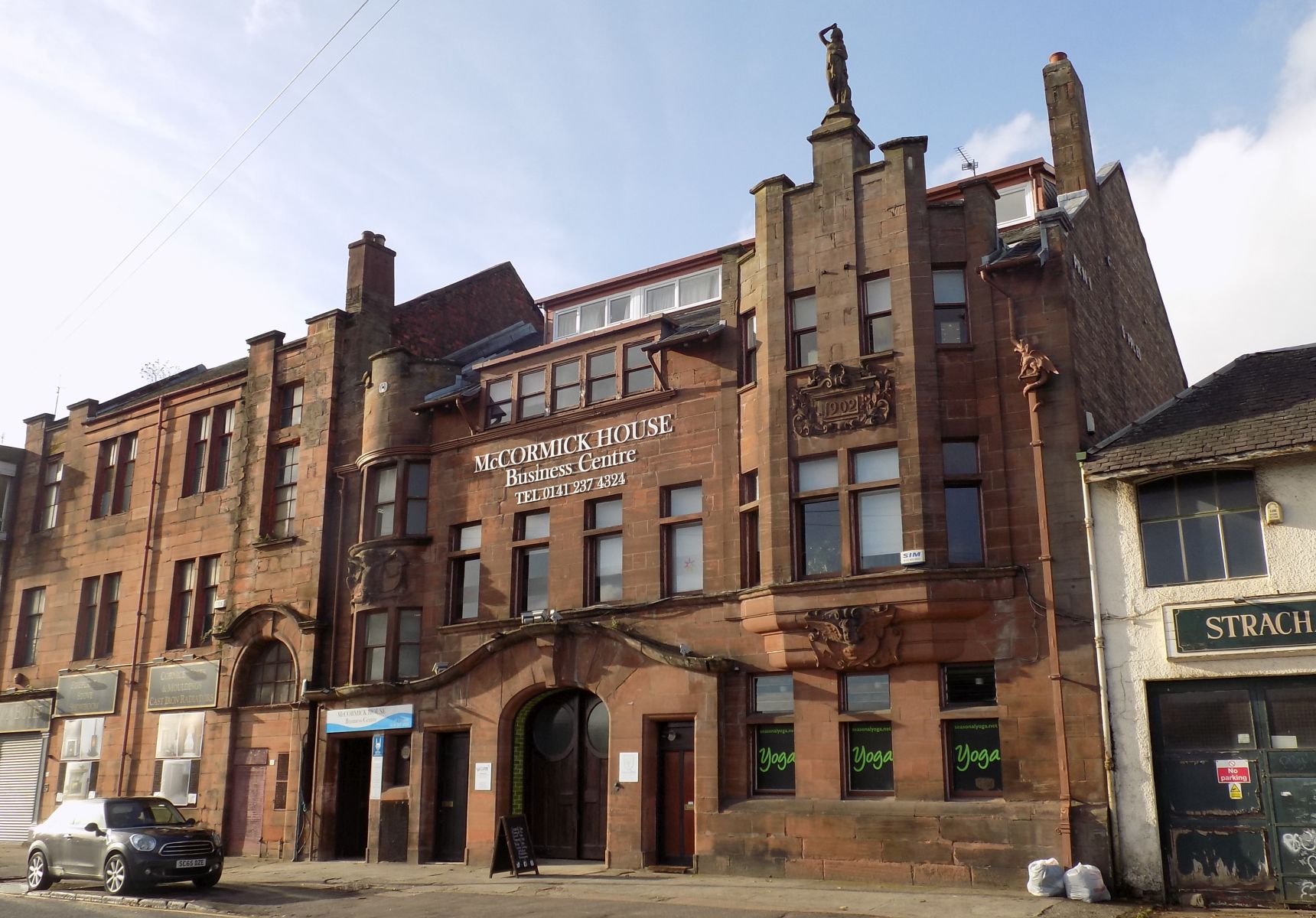 McCormick House in Darnley Street - Print works built 1902 in the Art Nouveau style - statue of Minerva and the lead griffin rainwater collector