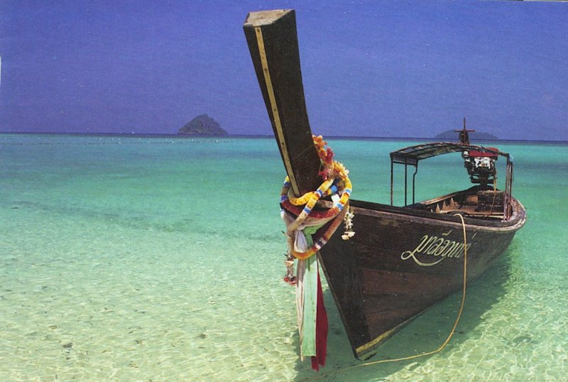 Tour Boat on the beach in Phang Nga Bay in Southern Thailand